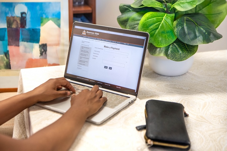 Person typing on laptop